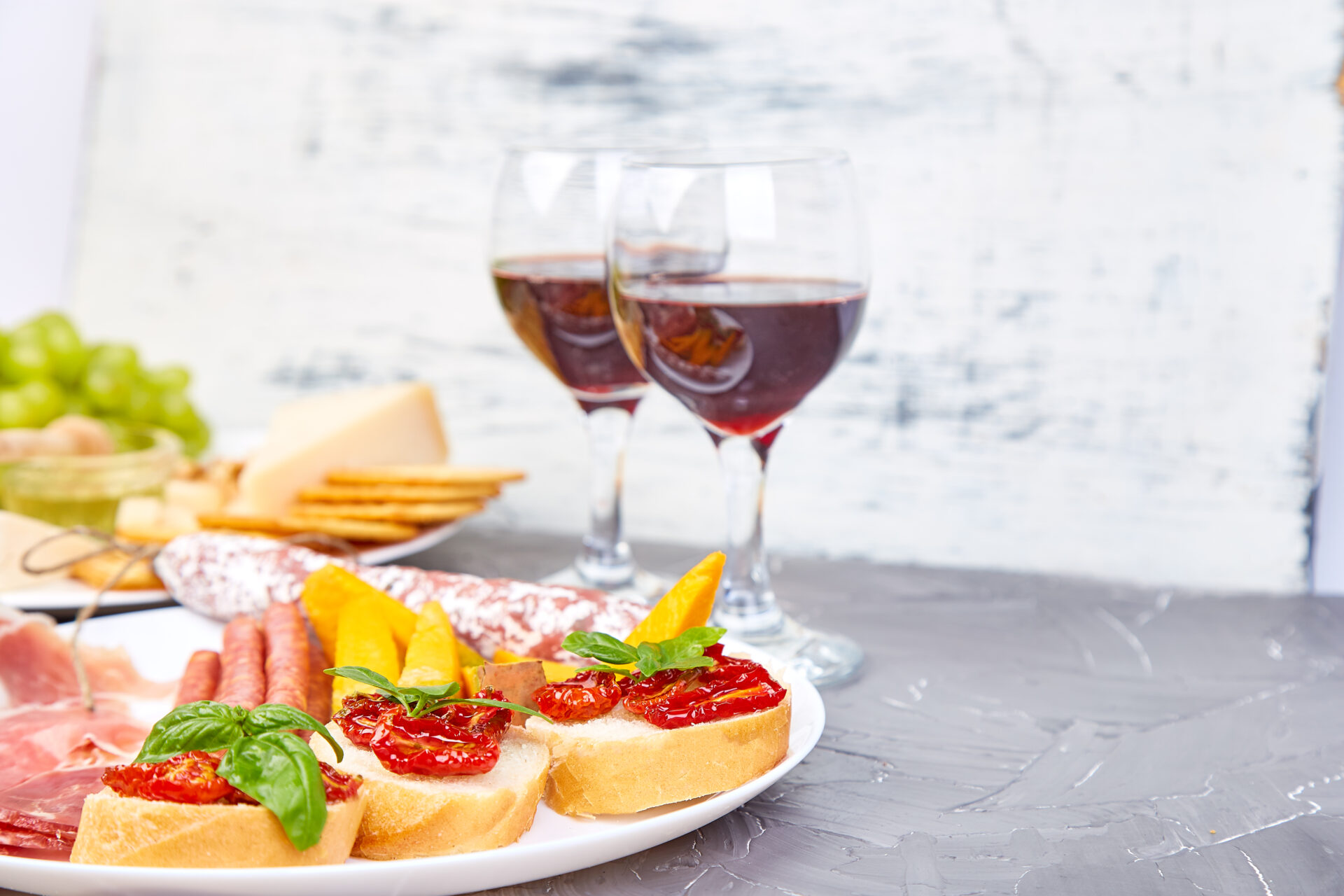 Italian antipasti wine snacks set wine in glasses.